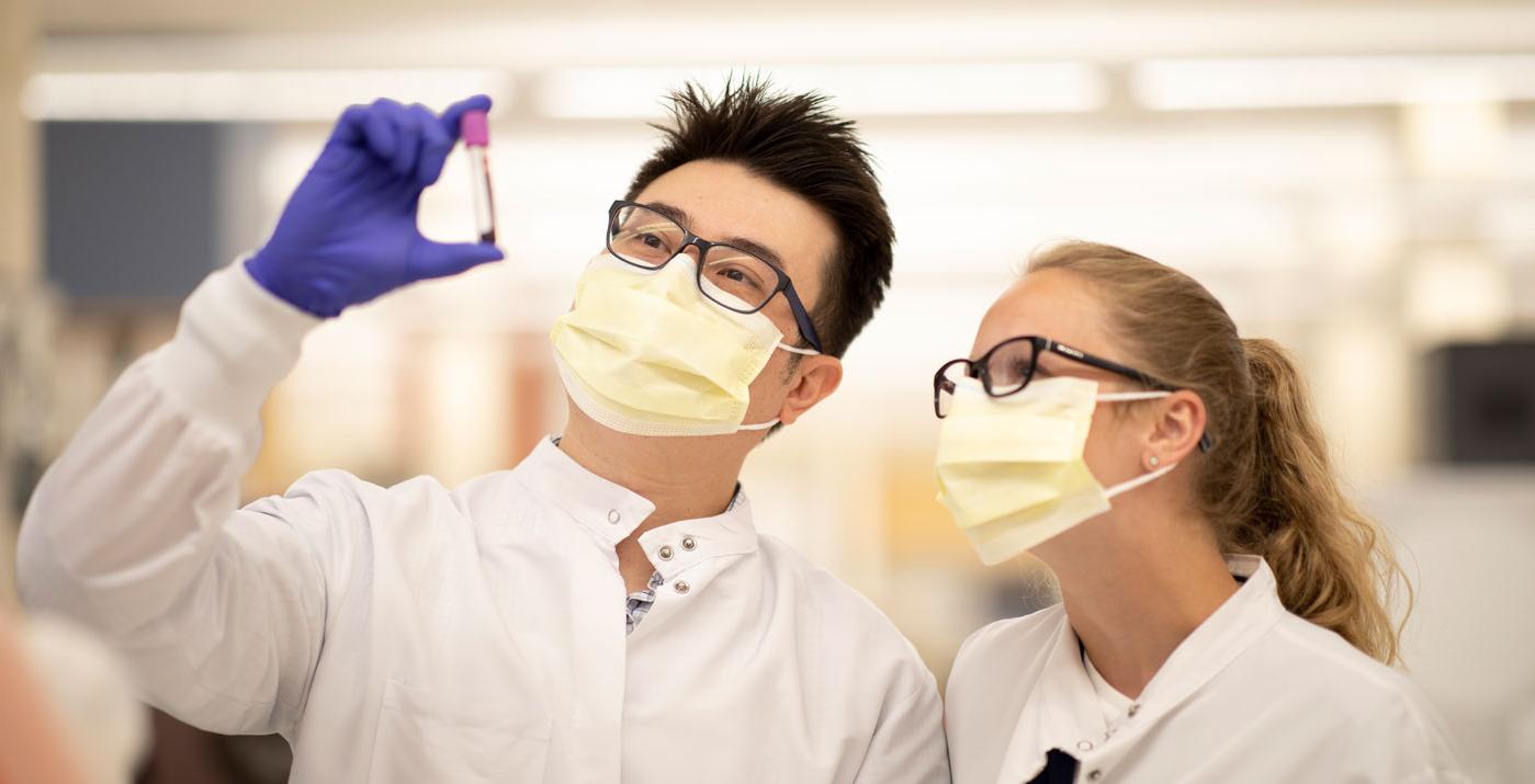 Students observing a vial