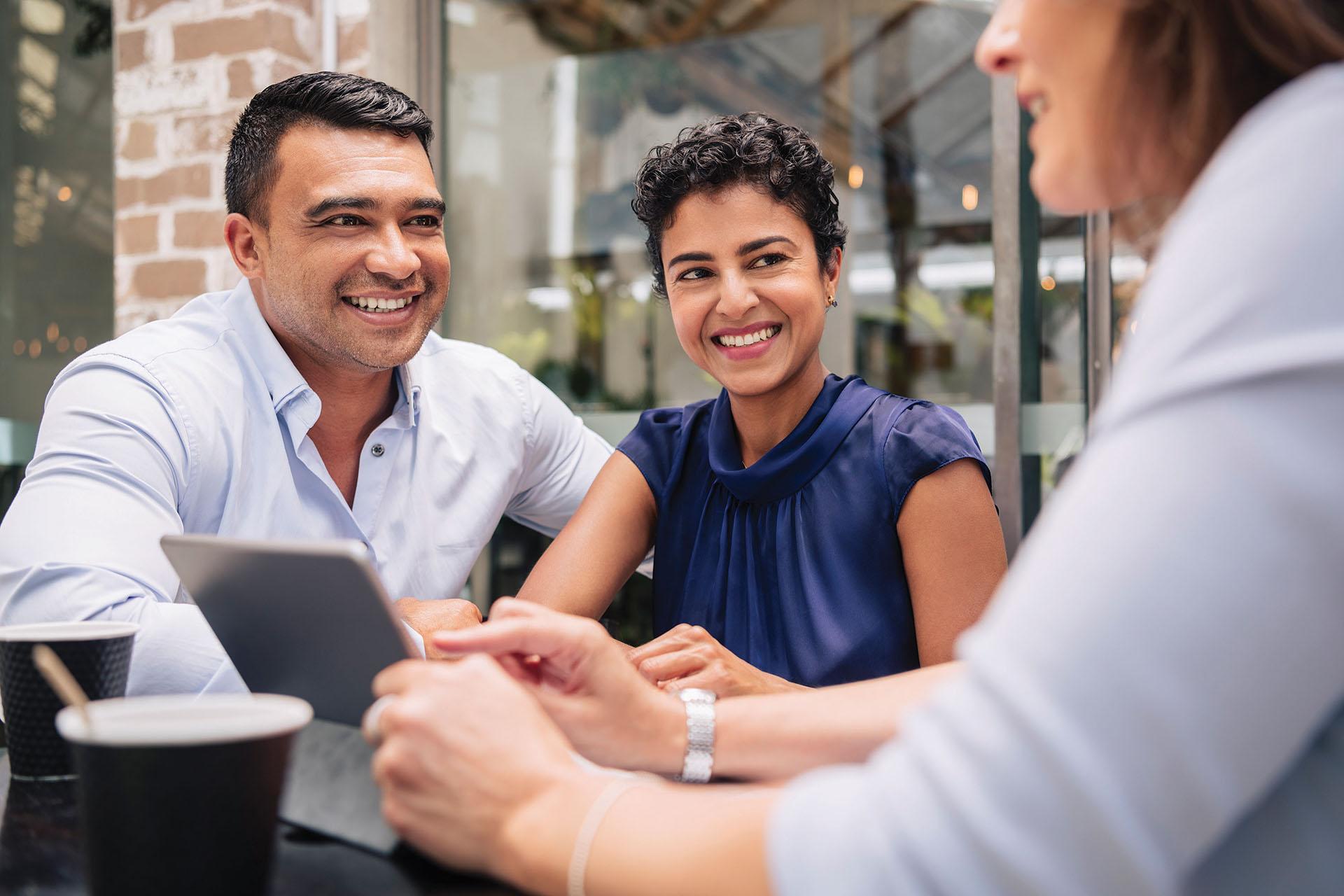 Three people in a conversation