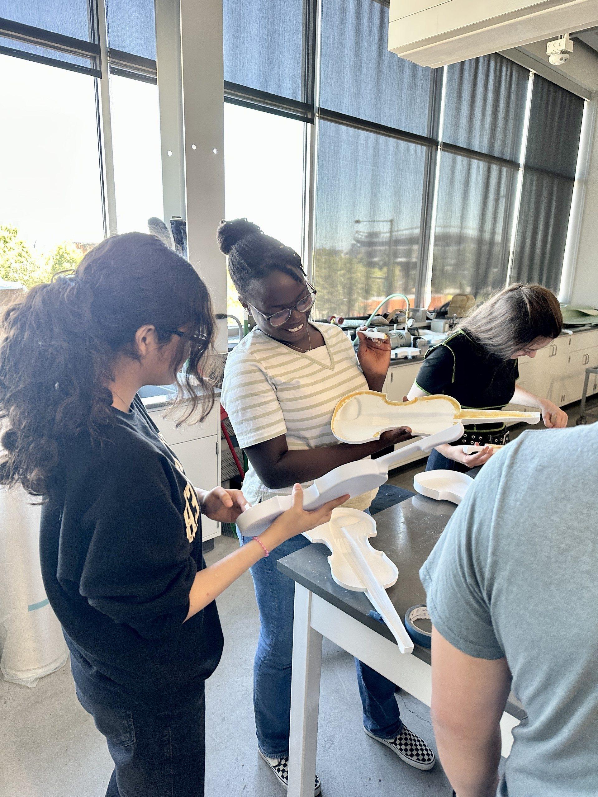 Students working on making 3D printed violins